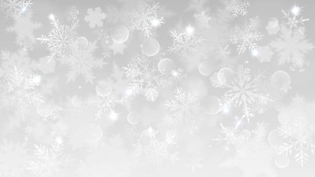 istock Christmas background of blurred snowflakes 1016804286