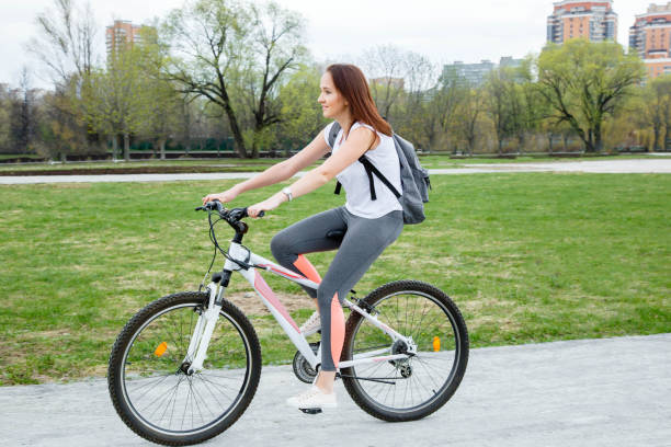 istock Woman cycling in a park 1016807198