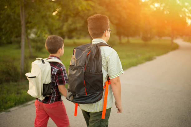 istock School boys walking to school 1016818654