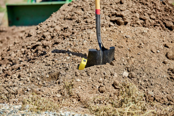 istock Shovel and Tape Rule in a dirt pile 1016829226