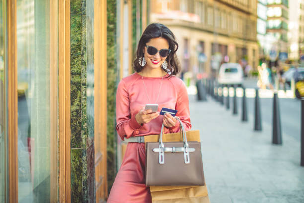 istock Young woman is ordering goods on her mobile 1016832050