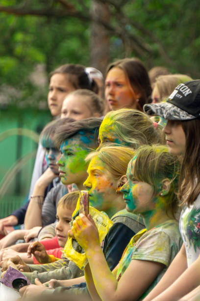 Happy girls at the holi colors and music festival in Russia stock photo