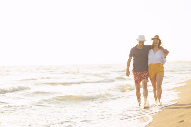 istock Beach of summer time and two lovers 1016840700
