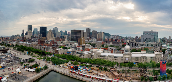 Amazing waterside view of the City of Montreal in Quebec Canada under a dramatic cloudy sky