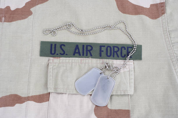 istock US AIR FORCE branch tape with dog tags on desert camouflage uniform 1016877246