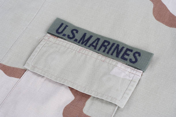 istock US MARINES branch tape with dog tags on desert camouflage uniform 1016877320