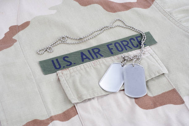 istock US AIR FORCE branch tape with dog tags on desert camouflage uniform 1016877356