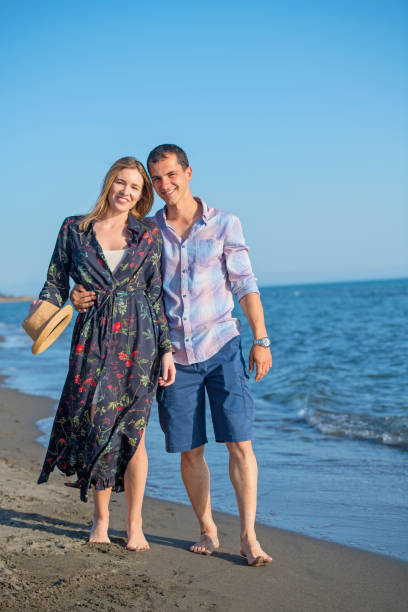 istock Beach of summer time and two lovers 1016877364