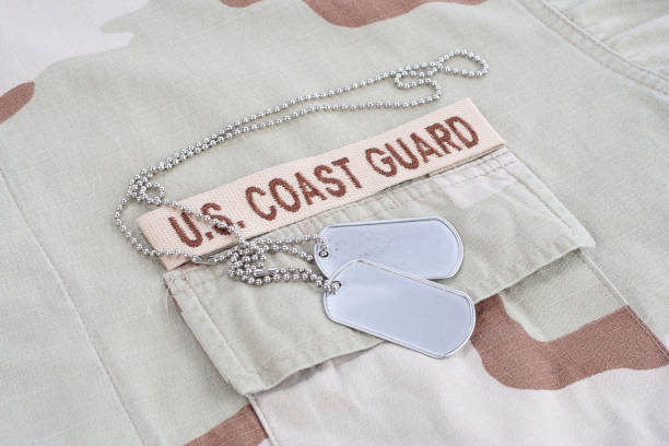 istock US COAST GUARD branch tape with dog tags on desert camouflage uniform 1016877468