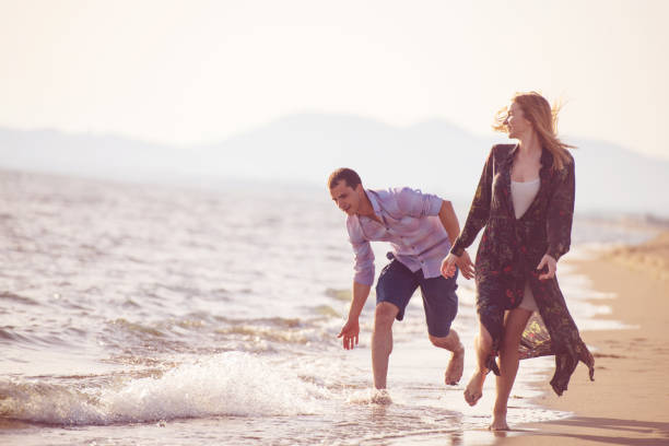 istock Beach of summer time and two lovers 1016882434