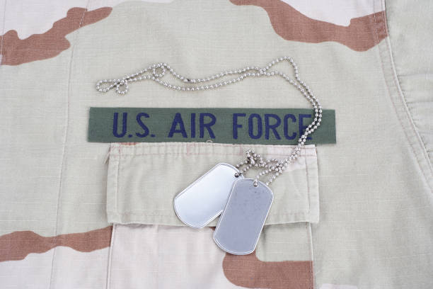 istock US AIR FORCE branch tape with dog tags on desert camouflage uniform 1016884900