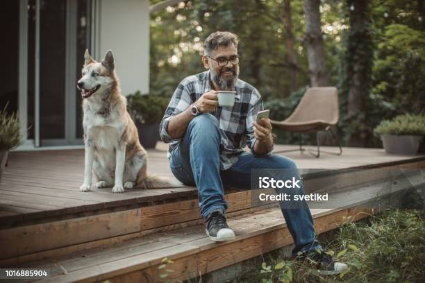 Weekend Activities Stock Photo - Download Image Now - Men, Dog, Outdoors