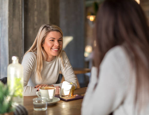 istock Girls gossiping at cafe restaurant 1016890260