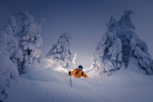 powder skiing Powder skiing lit with flash. ski resort flash stock pictures, royalty-free photos & images