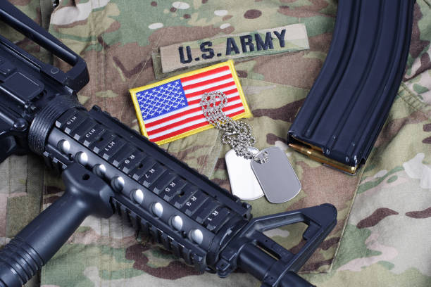 istock M4 carbine with ammunition on US Army uniform 1016895186