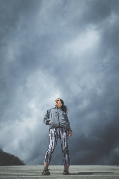 istock fitness woman and sky 1016909472