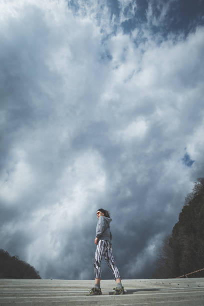 istock fitness woman and sky 1016909494