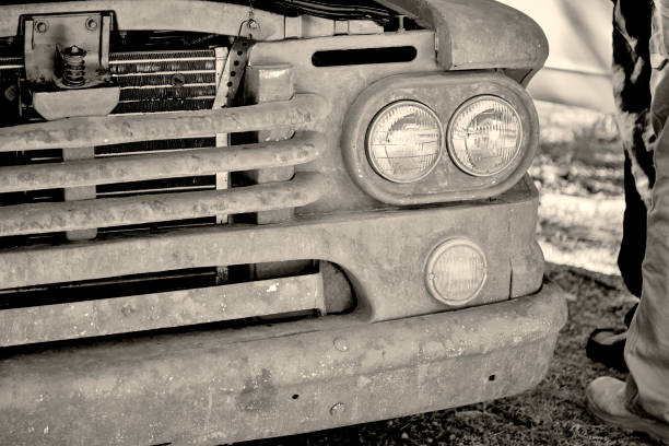 istock Front Grill of a Rusty Old Truck in Black and White 1016926350