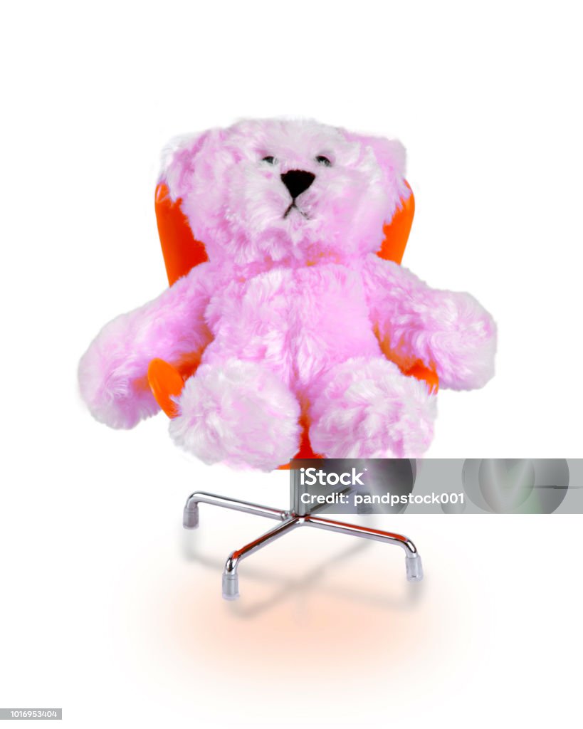 Little Pink Bear Doll Sitting In Orange Chair On White Background ...