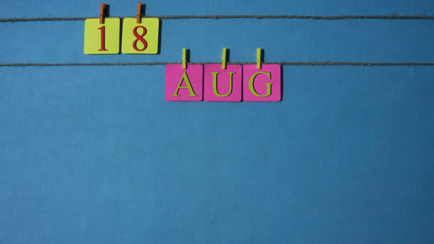 istock August, copy space with rope colored papers calendar 1016955978