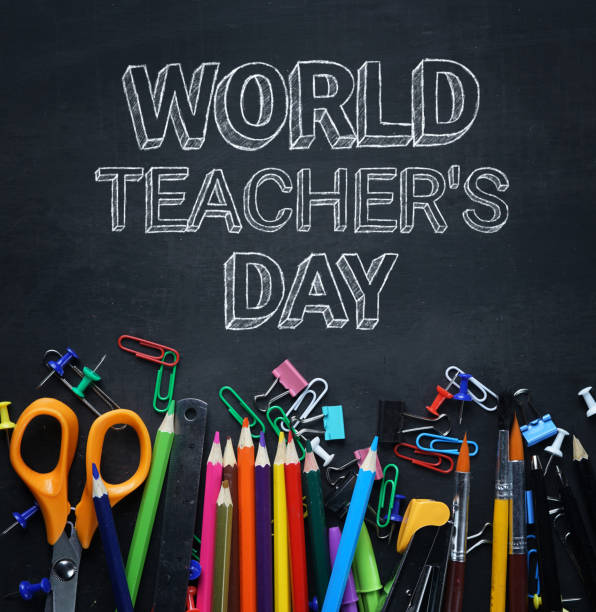 World Teacher's Day Text. School Stationary on Blackboard Top View World Teacher's Day Text. School Stationary on Blackboard Top View World Teachers Day stock pictures, royalty-free photos & images