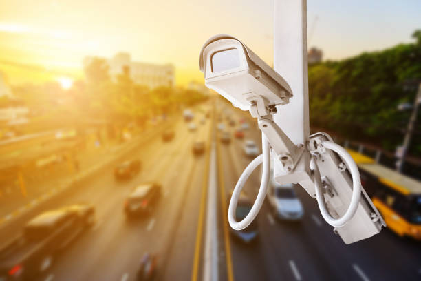 istock traffic security camera surveillance (CCTV) on road in city 1016978320