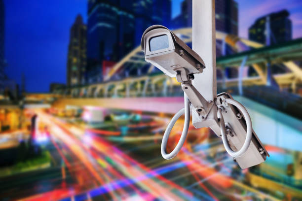 istock traffic security camera surveillance (CCTV) on road in city 1016978338