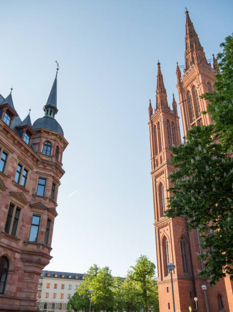 Marktkirche in Wiesbaden on a summers afternoon with a plane flying through in the background