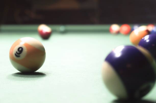 istock Billiards balls on a green board 1017008632