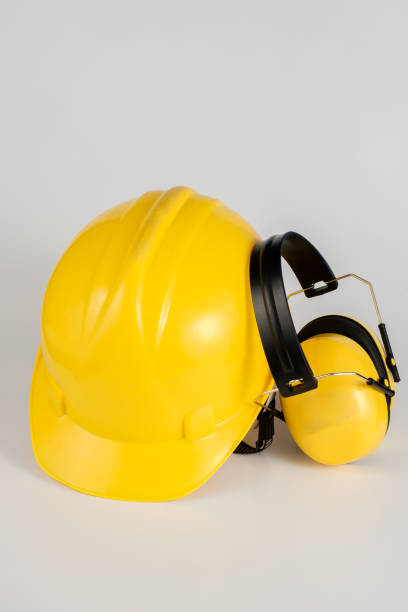 istock Helmet and hearing protection on a white table. Safety and hygiene accessories for construction workers. White background. 1017019072
