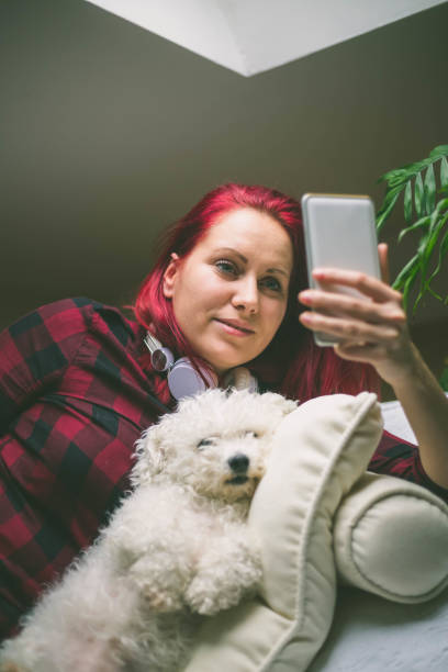 istock Young woman holding her phone 1017021276