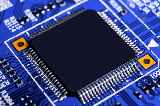 istock Macro shot of a Circuitboard with resistors microchips and electronic components. Computer hardware technology. Integrated communication processor in blue tones. Semiconductor. PCB. Closeup 1017048704