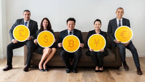 istock Business people holding currency icons 1017054888