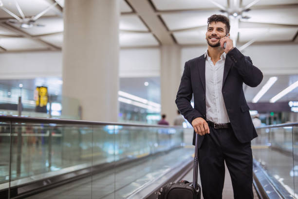 istock Travelling businessman making phone call 1017076698