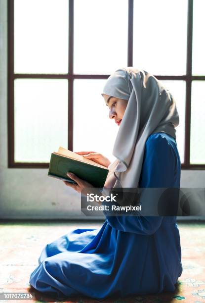 Muslim Woman Reading From The Quran Stock Photo - Download Image Now - Islam, Praying, UK