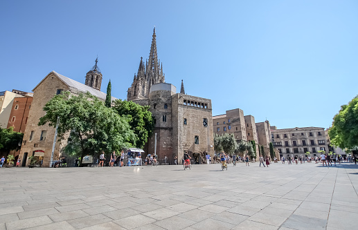 BARCELONA, SPAIN - JULY 17, 2018: View of the Pla de la Seu square. This square, built in 1421, is famous for the fair, where locals buy all sorts of the accessories for the Christmas crib.