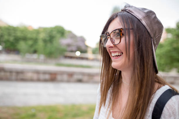 istock Front view portrait of a young happy female caucasian student holding a notebook 1017083110