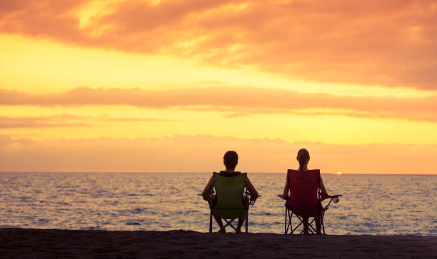istock Couple relaxing on the beach 1017117374