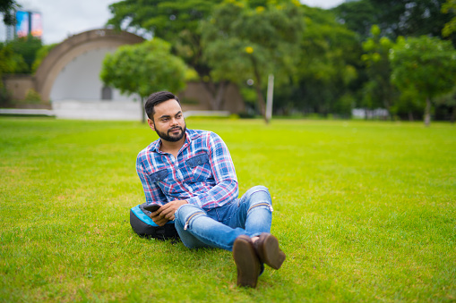 Portrait Of Young Handsome Bearded Indian Man In Lumpini Park