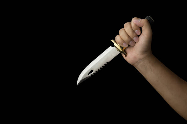 istock close up of hand holding a combat knife 1017128222
