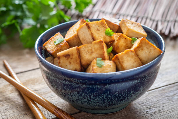 istock Fried tofu in bowl, Vegetarian food 1017140788