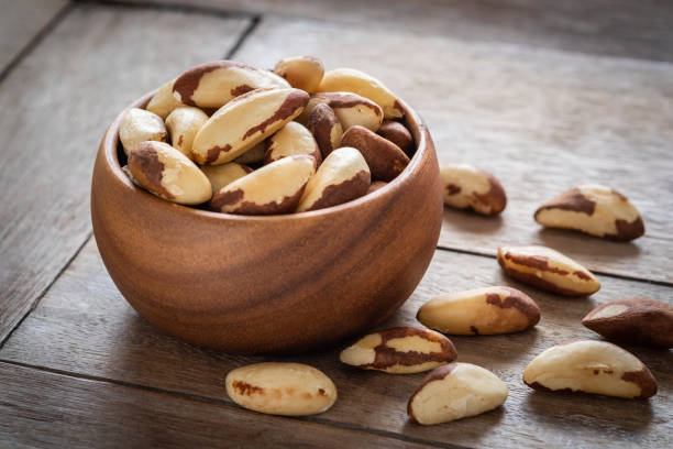 istock Brazil nuts in wooden bowl 1017141054