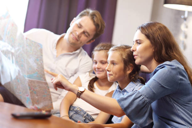 istock Happy family relaxing in hotel room 1017143784