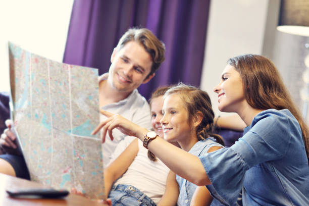 istock Happy family relaxing in hotel room 1017143836