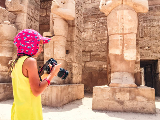istock Young Girl Photographing Ancient Temple in Egypt 1017144032