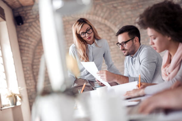 istock Businessman explaining something to his colleagues while having a meeting 1017147376