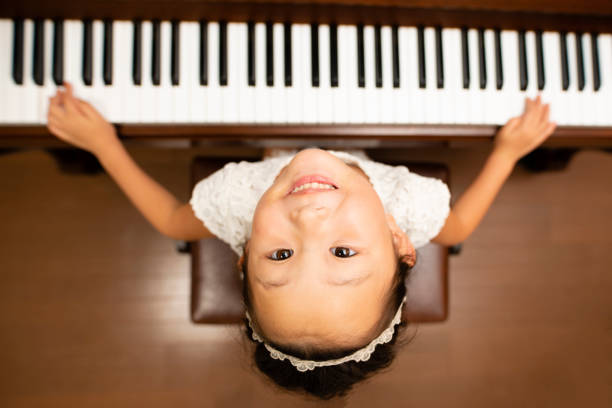 istock Girl play the piano 1017150016