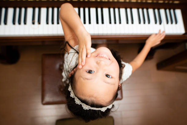 istock Girl play the piano 1017150024