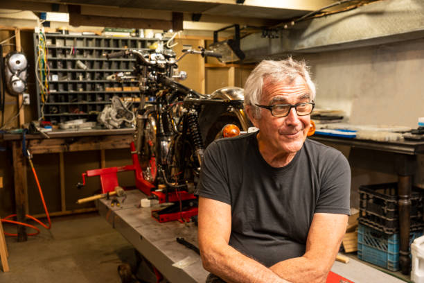 A specialist classic motorcycle restorer in his workshop