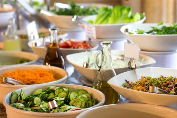 Salad bar at the hotel. Fresh cucumber, carrots and olive oil